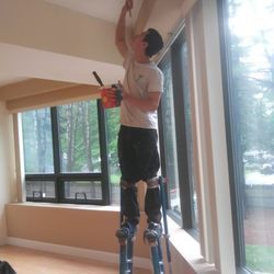 Happy Painters crew member at work on an interior painting project in Boston