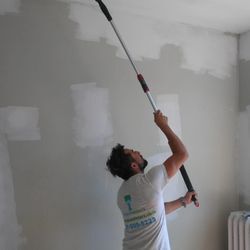 Happy Painters crew prepping walls and trim before interior repaint